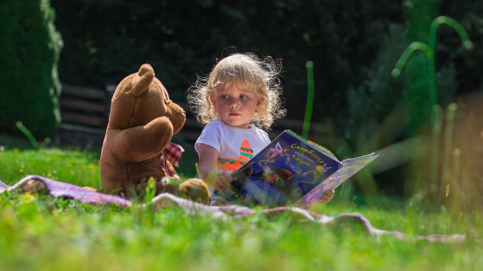 Girl Sitting Beside A Teddy Bear